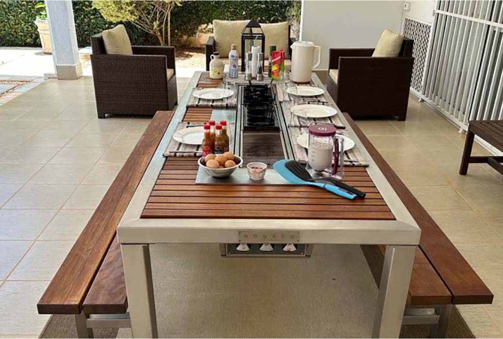 outdoor dining table with barbeque grill